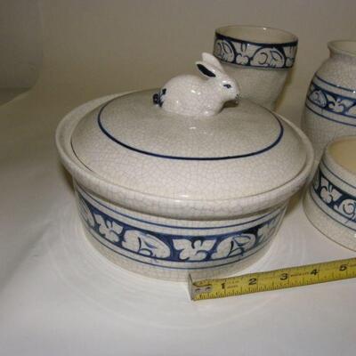 Lot of Dedham Pottery: Lot of five Dedham Pottery pieces: Covered round baking dish; straight-sided pitcher; rounded pitcher; boot-shape...