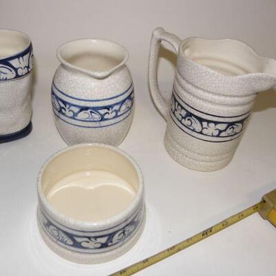 Lot of Dedham Pottery: Lot of five Dedham Pottery pieces: Covered round baking dish; straight-sided pitcher; rounded pitcher; boot-shape...