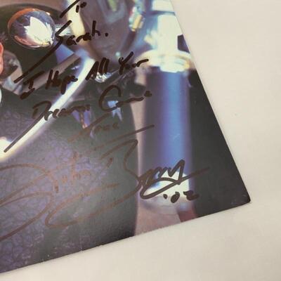 .37. Two John Berry Autographed 8x10s