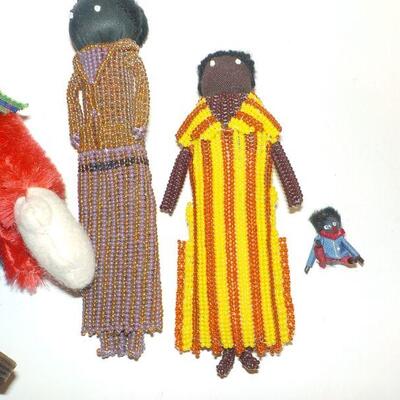 4 Goggywog and antique mini doll. 