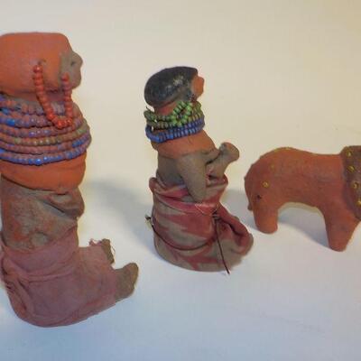 3 Antique handcrafted dolls and lion.