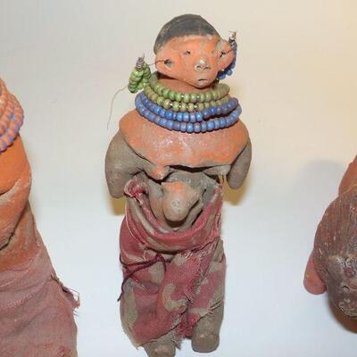 3 Antique handcrafted dolls and lion.