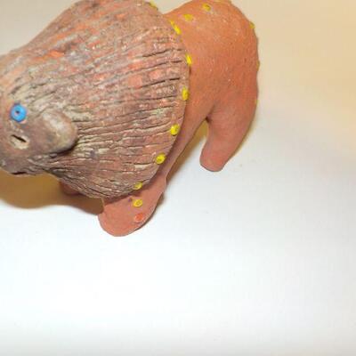 3 Antique handcrafted dolls and lion.