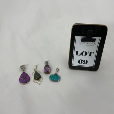 .69. Four Sterling Pendants | Various Stones