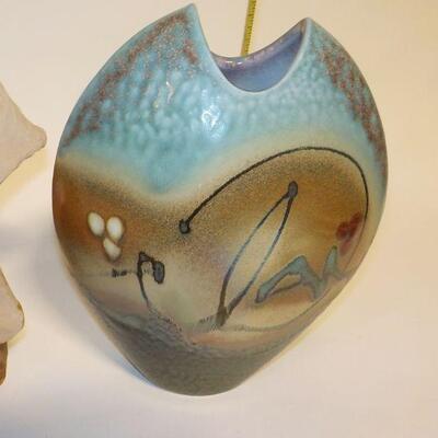 Hand Carved face and hand crafted vase.
