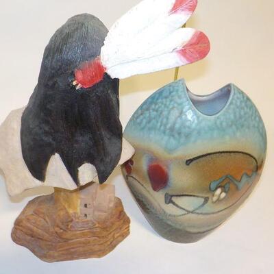 Hand Carved face and hand crafted vase.
