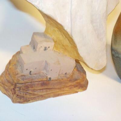 Hand Carved face and hand crafted vase.