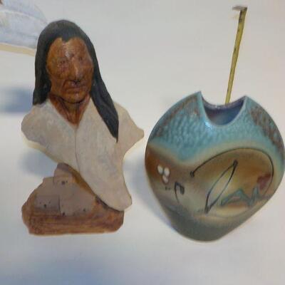 Hand Carved face and hand crafted vase.