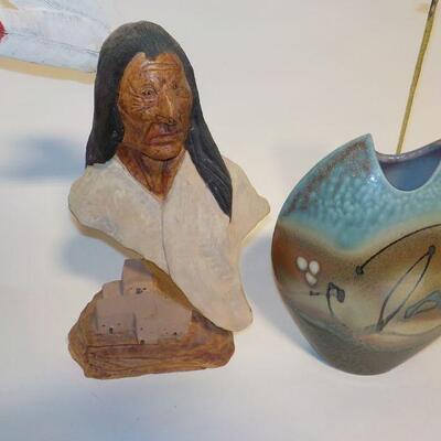 Hand Carved face and hand crafted vase.