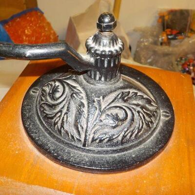 Vintage coffee grinder and wood boat model.