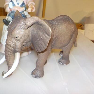 4 collector pieces Norman Rockwell bell, Hummel, Meissen, Brass Elephant.