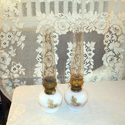 Pair Aladdin oil lamps, painted milk glass bases, 9" with 12" chimneys (#45)
