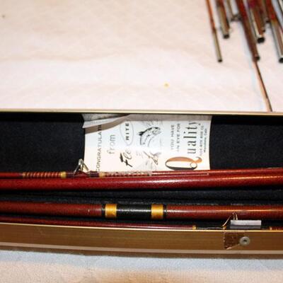 Two fiberglass fishing poles in metal case (#138)