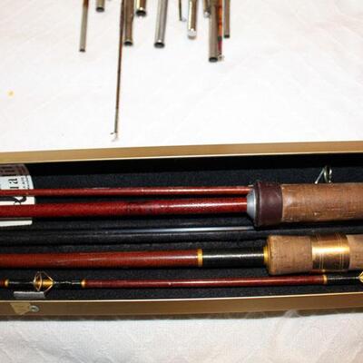Two fiberglass fishing poles in metal case (#138)