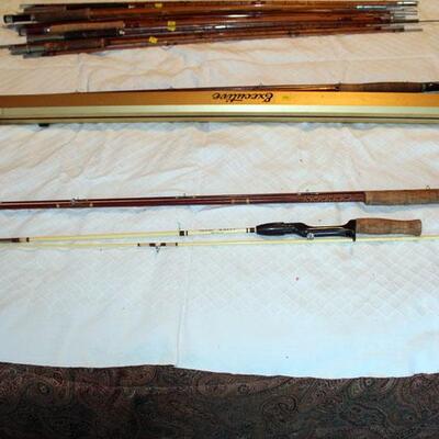 two fiberglass fishing poles, 1 Shakespeare, one unsigned (#141)