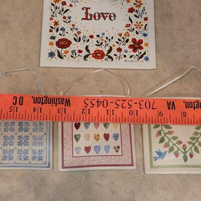 Lot 9: New Celebration Quilts Porcelain Trivet, Vintage Love Trivet & (3) Ceramic Quilt Hanging Deco