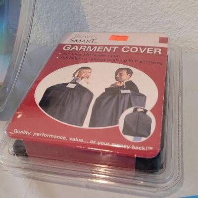 Lot 8: Assorted NEW Finds: Camera, Bumper Sticker and Garment Bag