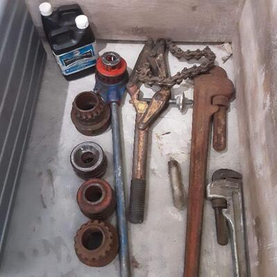 lot 114 -Ridgid 700 pipe threading machine, ladder, submersible 1/3hp pump, pipe wrench, chain wrench, puller in bucket, etc