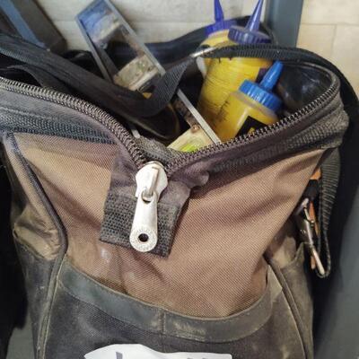 lot 124 - Canvas tool bag of asstd levels, squares, measuring angles, strait line dust, micrometer, plumb lines, measuring tapes, etc