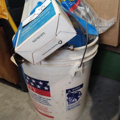 lot 128 -Bucket of assorted plumbing tubing, water heater installation kit etc.
