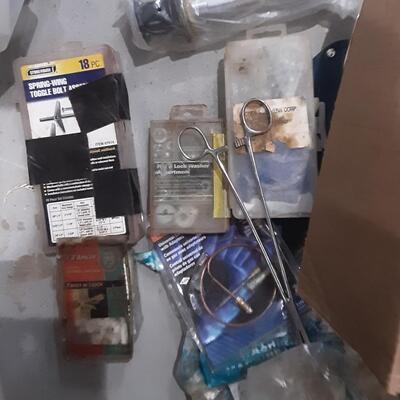 lot 141 - Hose, asstd plumbing, tape, screws, anchor bolts, washers, gas pilot light control, gauge, etc.