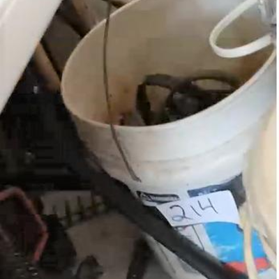 LOT 214 - Bucket of bungees, etc
