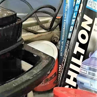 \lot 223 - Bin of automotive, car waxer, jack, waxes, Chilton and Haynes repair manuals, etc.