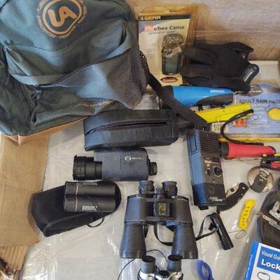 lot 231 - Green backpack, binoculars, flashlights, pancho, night vision scope, gloves, pocket knives, lock picking book/set, etc.