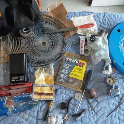 lot 266 - Tool bag of assorted parts and tools, including large reel, strapping, RotoZip disc, screwdrivers and pliers, needle files, etc