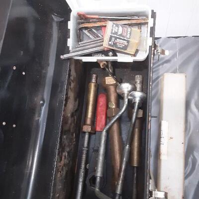 lot 267 Black metal tool box and contents, ext cord, airhose
