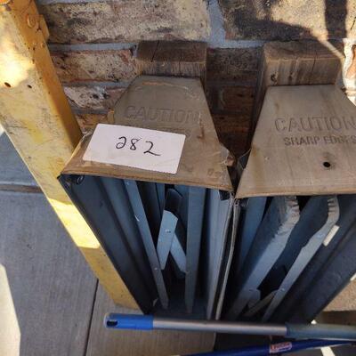 lot 282 - 2 Gray/1 yellow Metal Saw horses