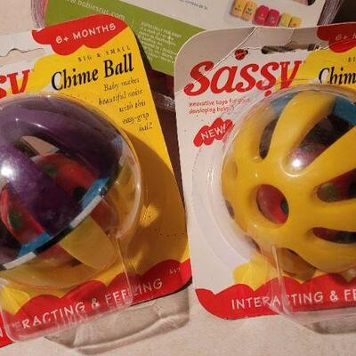 Lot 35: Assorted NEW Baby Items - Toy Balls + Neck Wings