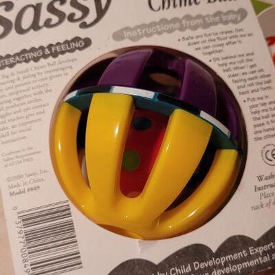 Lot 35: Assorted NEW Baby Items - Toy Balls + Neck Wings
