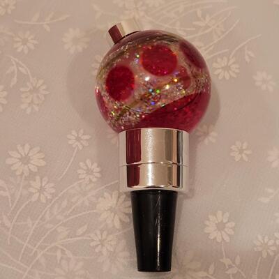 Lot 192: Light Up Wine Stopper, Plastic Treat Containers and Merry Christmas Cake Taker and Disposable Plates and Napkins
