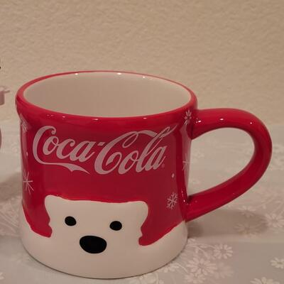 Lot 195: Christmas Coca-Cola Coffee Cup and Marshmallow Kicking Penguin Hot Cocoa Mug