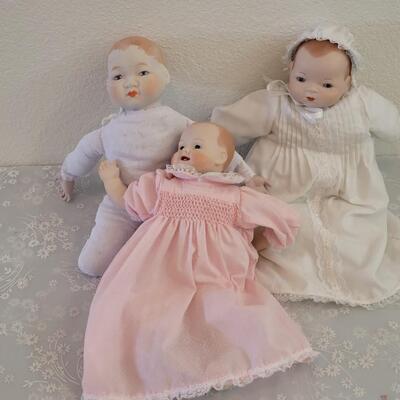 Lot 296: Handpainted China Dolls (one is missing a finger)