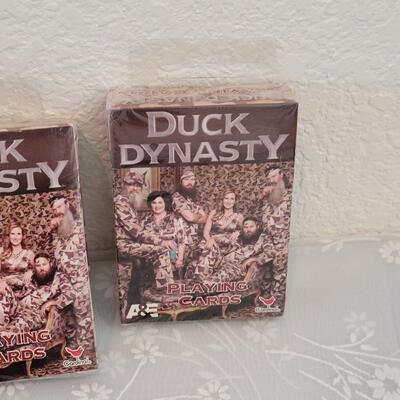 Lot 341: Duck Dynasty CD, Playing Cards and God Bless Photo Visor Clip