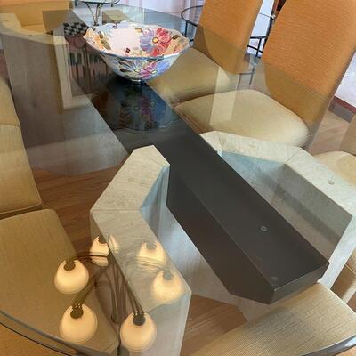 Fabulous glass and marble dining table with freshly upholstered pale yellow chairs