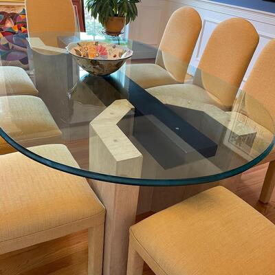 Fabulous glass and marble dining table with freshly upholstered pale yellow chairs