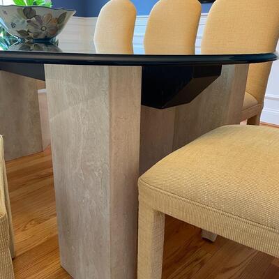 Fabulous glass and marble dining table with freshly upholstered pale yellow chairs