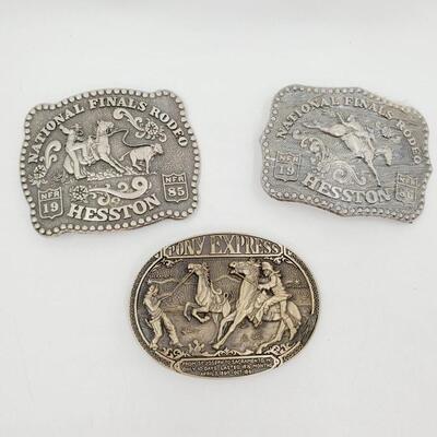 1985-86 NATIONAL FINALS RODEO AND PONY EXPRESS BELT BUCKLE BUNDLE OF 3