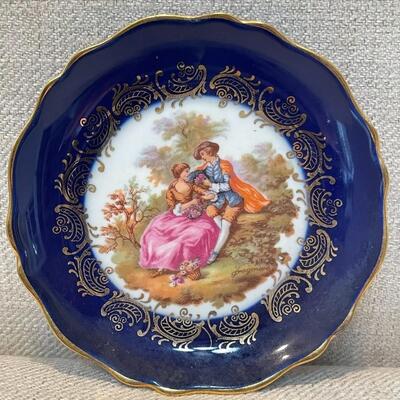 LOT 48 - Limoges veritable porcelaine d art courting couple blue trinket plate with stand