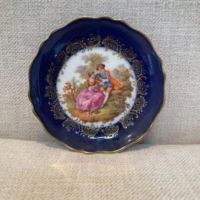 LOT 48 - Limoges veritable porcelaine d art courting couple blue trinket plate with stand