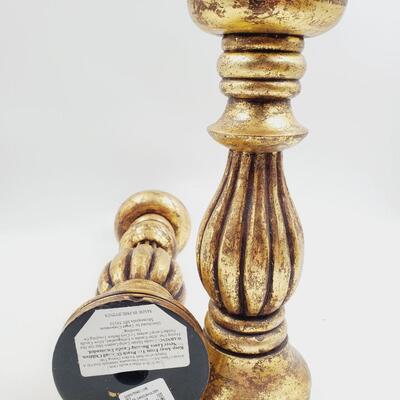 GOLD COLORED PILLAR CANDLE HOLDERS SET OF 4