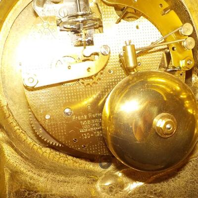 19 Century French Table clock with gilt and European design.