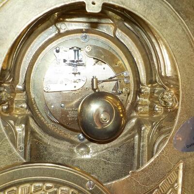 19 Century French Table clock with gilt and European design.