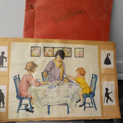 1920's to 1930's scrap book of Ad's and post cards.
