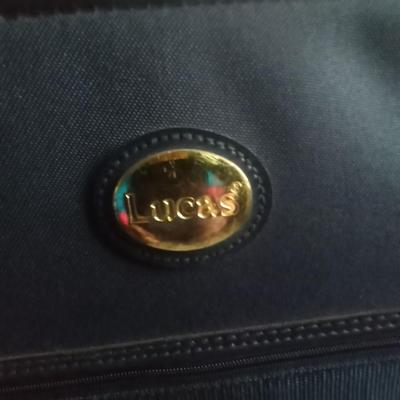 TWO MATCHING LUCAS SUITCASES ON CASTERS WITH PULL HANDLES