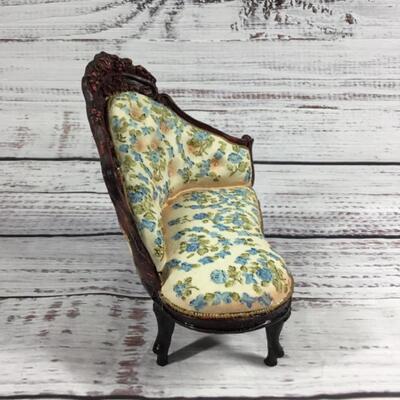 Floral antique couch with two bears figurines