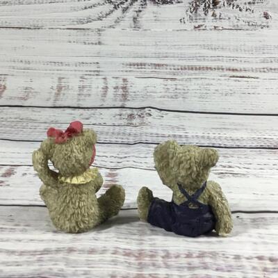 Floral antique couch with two bears figurines